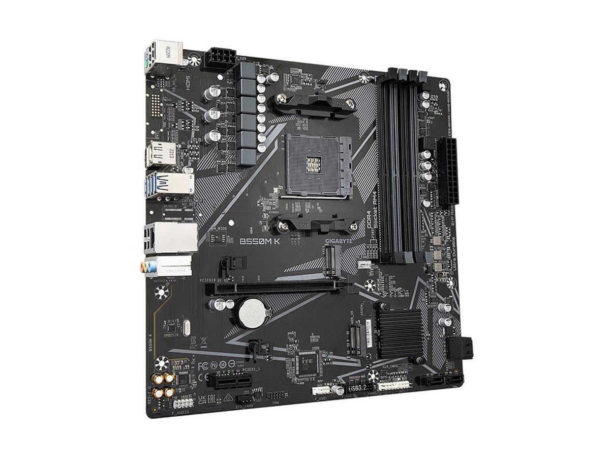 Backside of AMD B550M K Micro-ATX motherboard showing PCB, mounting holes, M.2 standoff and solder points