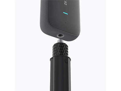 Insta360 selfie stick fully extended for high-angle action photography